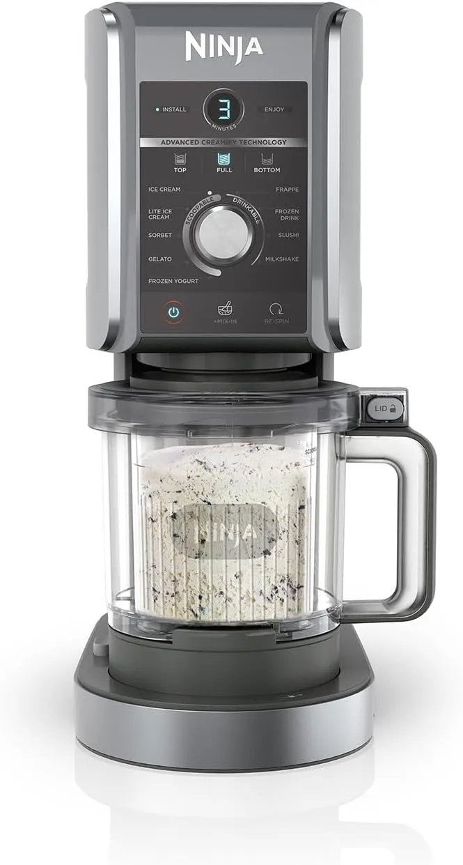 Ninja CREAMi Deluxe 10-in-1 ice cream and frozen dessert maker in silver with tubs and flavor options.