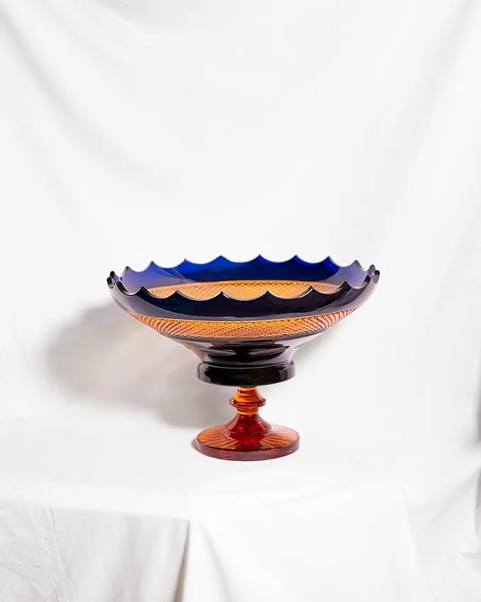 Elegant crystal glass fruit bowl with amber and blue accents for home décor.