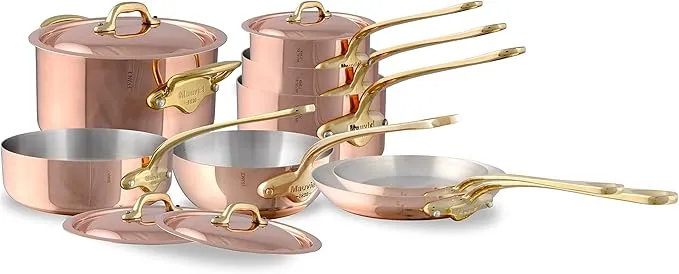 Mauviel M'150 12-piece polished copper and stainless steel cookware set with brass handles.