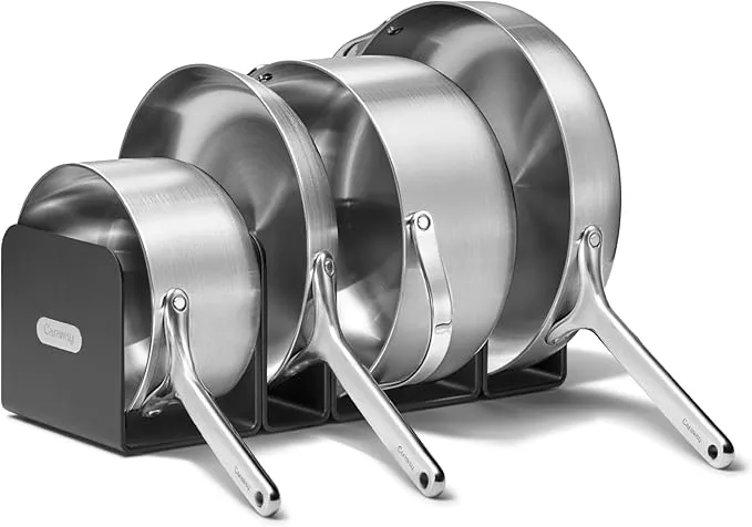 4-piece Caraway 5-ply stainless steel cookware set with fry pan, saucepan, and Dutch oven.