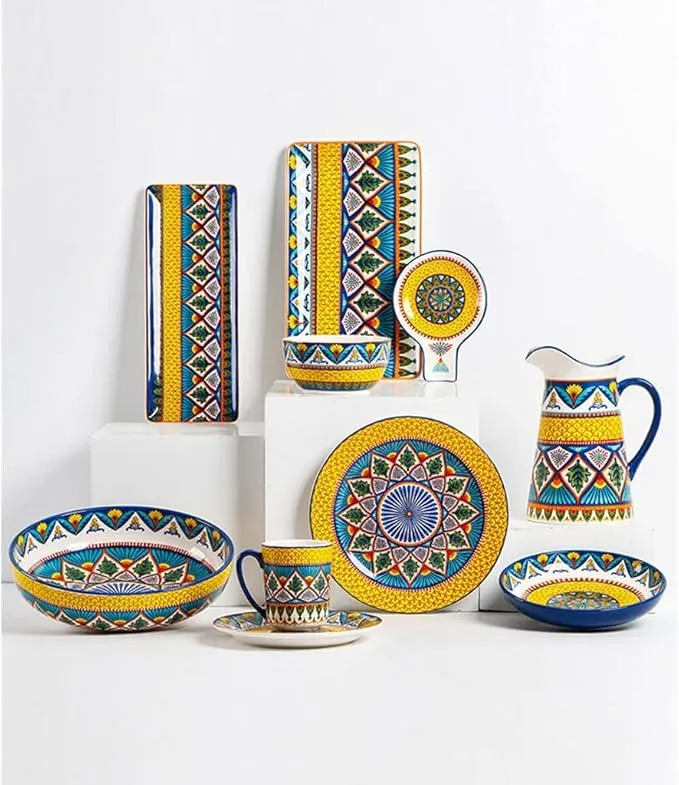 Hand-painted ceramic dinnerware set including plates, bowls, and mugs.
