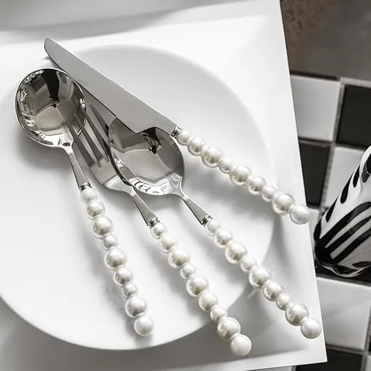 White stainless steel flatware set with pearl handle cutlery.