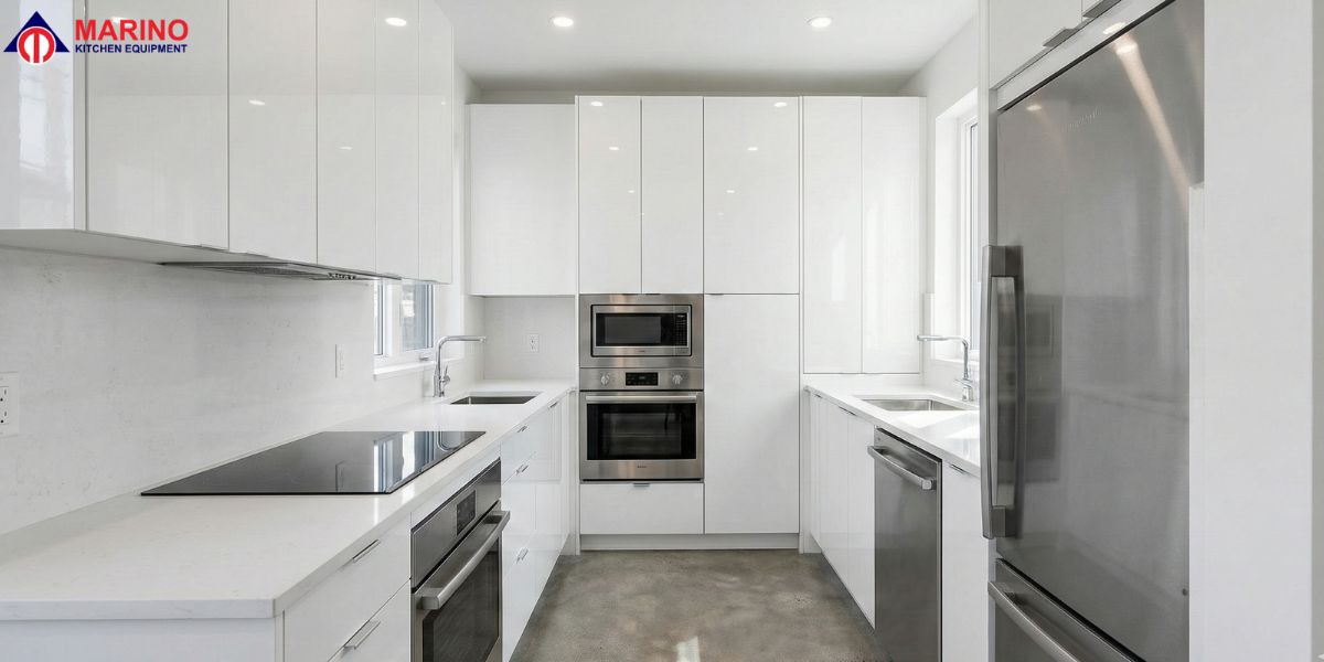 White kitchen cabinets with stainless steel appliances in a modern kitchen design